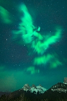 Three Sisters with an eagle shaped aurora above.